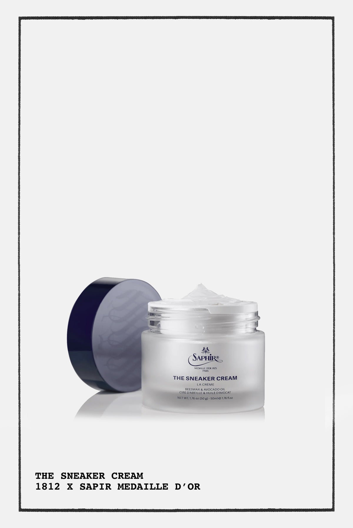 SAPHIR THE SNEAKER CREAM NEUTRAL, OPEN JAR WITH A PURPLE RIM, ON A PRINTED POSTER