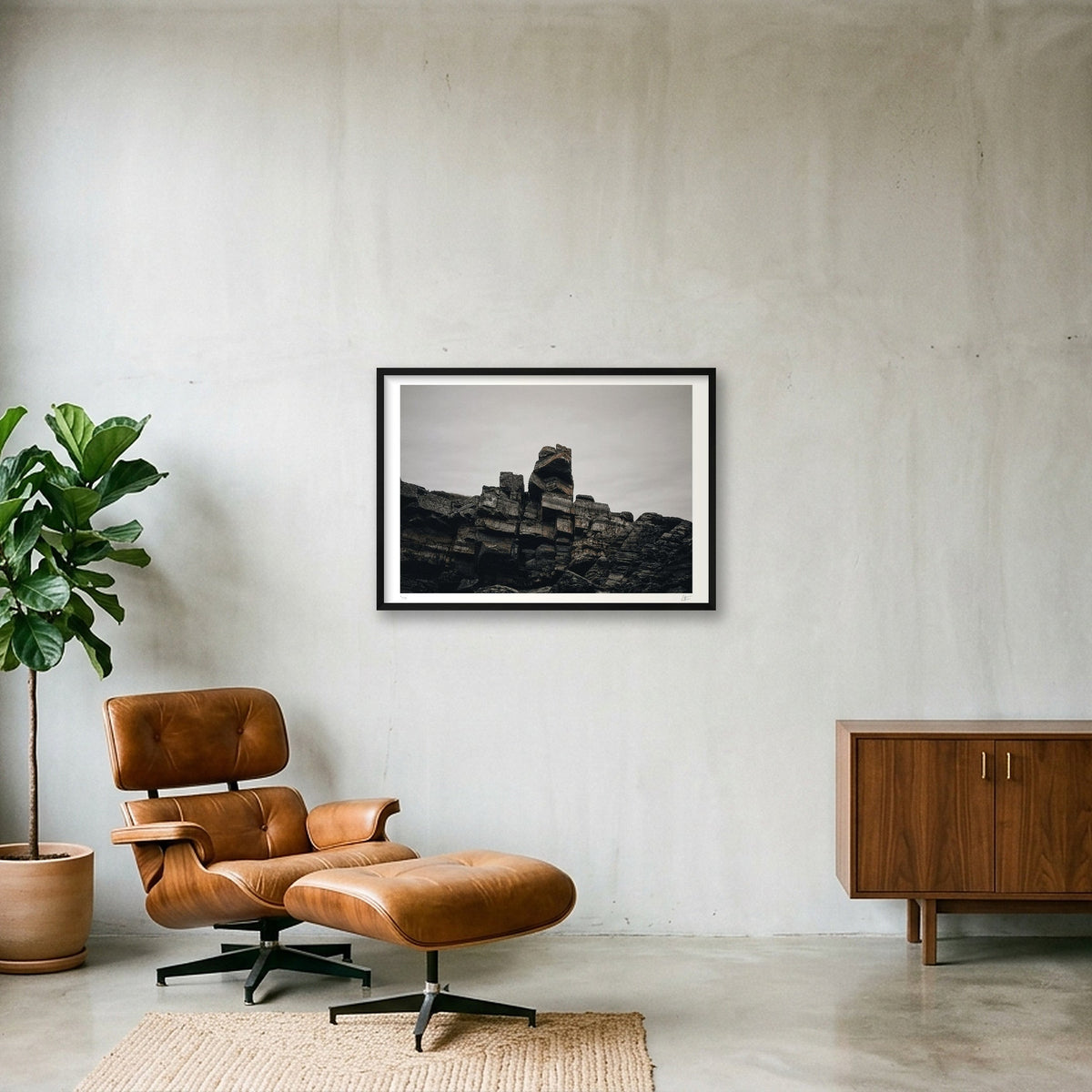 TARLAIR IN A BLACK FRAME, HANGING ON A CONCRETE WALL