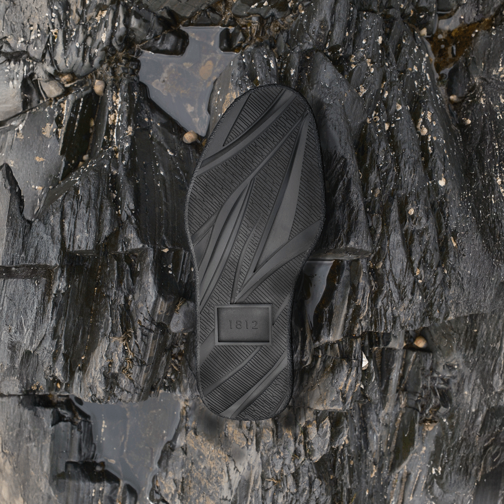 1812 trainer sole unit sat on the blsck jurassic rocks that inspired the design