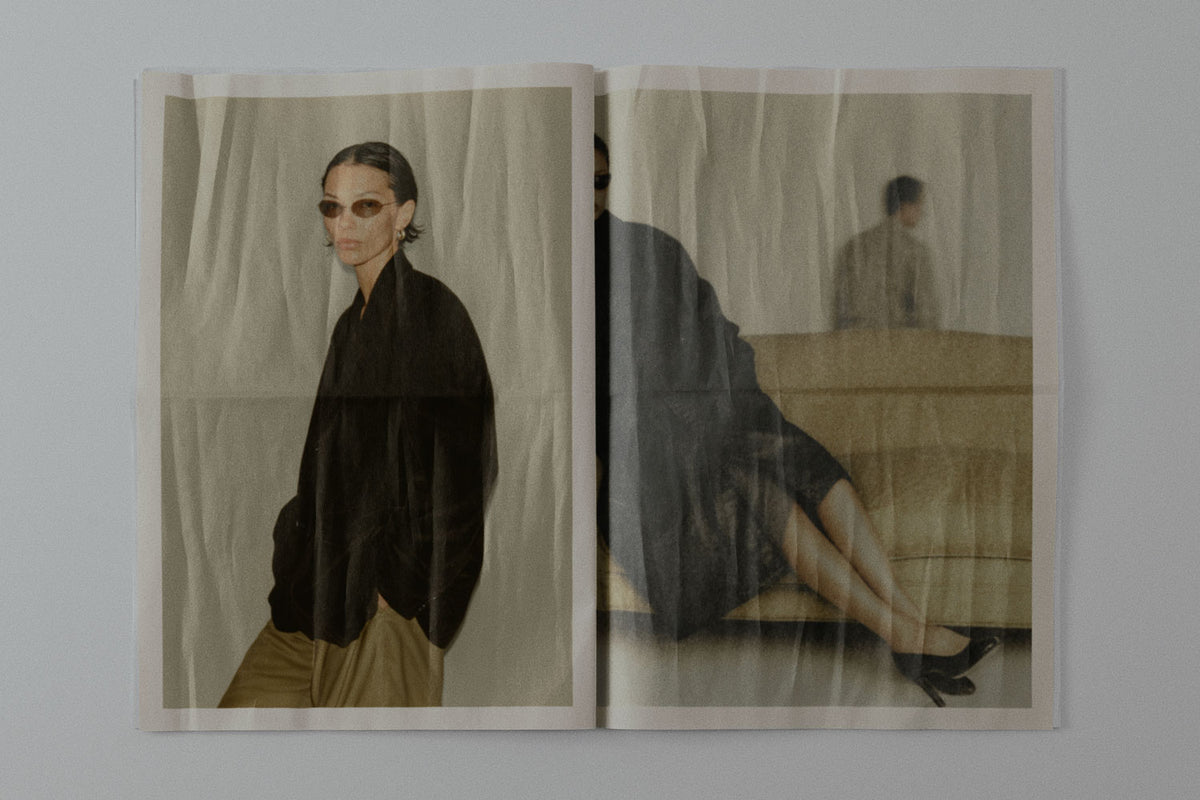 OPEN PRINTED BOOKLET SHOWING TWO PORTRAIT PHOTOGRAPHS
